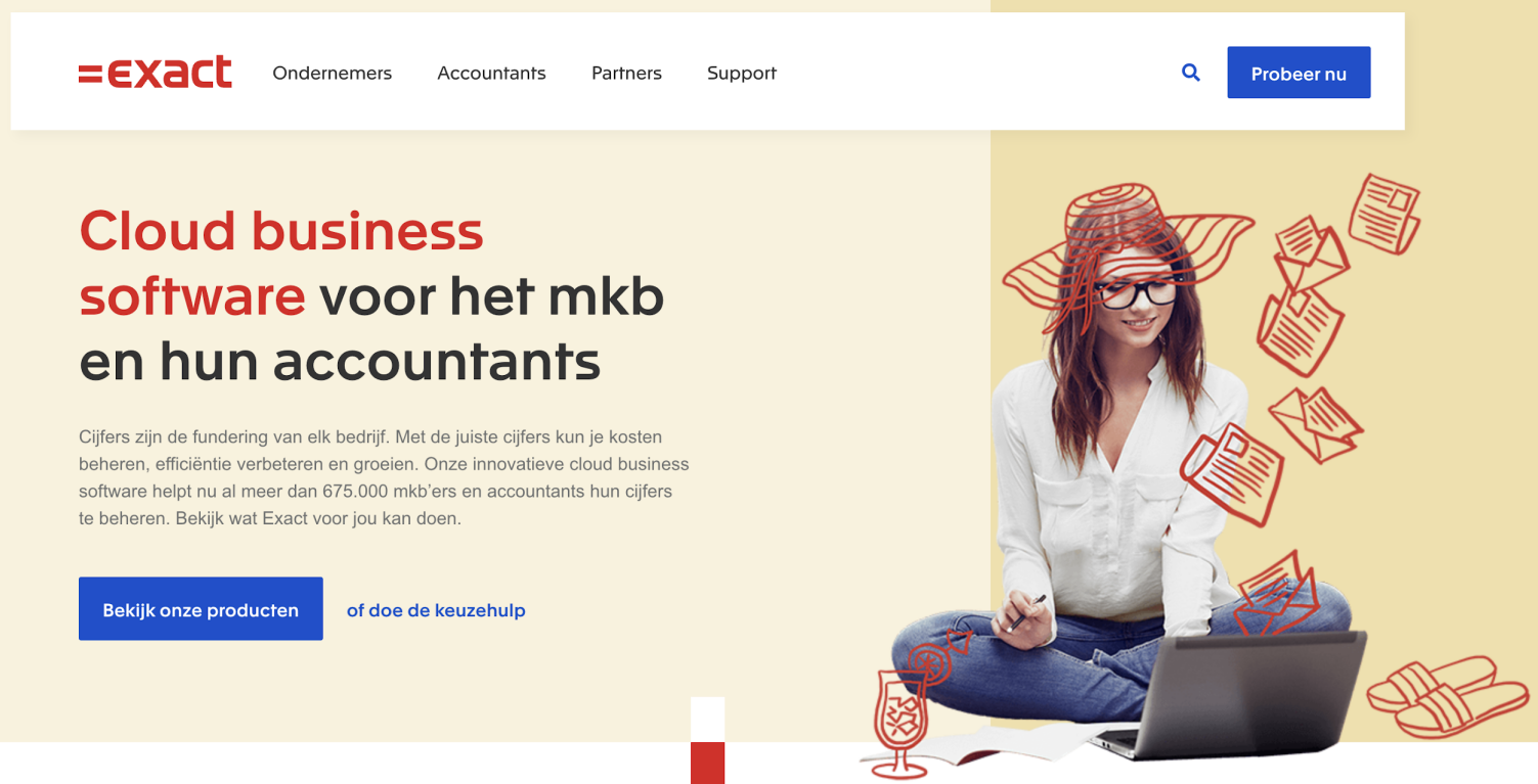 A person sitting cross legged in front of a computerDescription automatically generated